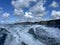 Ocean view cliffs of Moher with blue skies a fluffy clouds