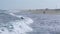 Ocean view and people surfing in Tavira Island