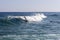 Ocean view and people surfing in Tavira Island coast beach