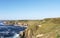 Ocean view to the horizon at a green cliff in England`s Land`s End. Cornwall, UK