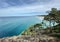 Ocean views and a surf beach taken from a rocky headland on a tropical island paradise off Queensland, Australia