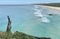 Ocean views and a surf beach taken from a rocky headland on a tropical island paradise off Queensland, Australia