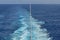 Ocean wake behind cruise ship.