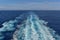 Ocean wake behind cruise ship.