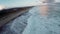 Ocean water with winter clouds in evening sky aerial