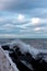 Ocean wave breaking against the rocks in Donostia, San Sebastian, Spain