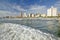 Ocean wave comes in Durban skyline, South Africa on the Indian Ocean