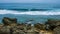 Ocean wave rolling toward with marine rocks in coast of Taiwan island. Seascape