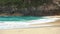 Ocean wave on tropical beach. White sand and crystal-blue sea. Kelingking beach Nusa Penida