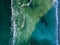 Ocean waves color of turquoise. Marine natural seascape background. Top view aerial from drone. Copy space.
