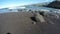 ocean with waves crashing on black sand in Tenerife, time lapse 4K