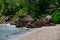 Ocean waves and granite rocks - Baie Lazare beach, Mahe Island, Seychelles.