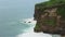 Ocean waves over high cliffs