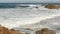Ocean waves and rocks, Monterey, Northern California, USA. 17-mile drive near Big Sur, seaside golf tourist resort on