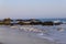 Ocean waves rolling in at the beach crashing into the rocks at El Matador beach