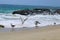 Ocean waves rolling into the beach over the rocks at 1000 Steps Beach