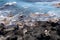 Ocean waves splashing upon black volcanic rock coastline on the Hawaiian Island of Kona, Hawaii, USA