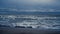 Ocean waves storming landscape beach. Dark sea tide water crashing nature coast.