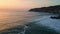 Ocean waves sunset beach nature. Sea water splashing rough cliffs evening coast