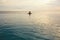 Ocean. Woman Standing In Sea. Girl Touching Water Surface And Looking Away. Beautiful Seascape And Female Silhouette.