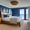 Oceanfront Escape: A coastal-inspired master bedroom overlooking the ocean, with a canopy bed, nautical accents, and a balcony t