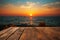 Oceanic elegance An empty wooden table framed by a stunning, blurred sea sunset