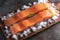 Oceanic freshness Salmon fillets portioned on ice with a pristine board