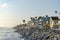 Oceanside beach houses in California with stairs on the natural rock seawall