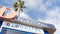 Oceanside nameboard sign and palm trees. Oside is the popular american tourist resort, pacific ocean west coast, San Diego County