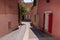 Ochre coloured buildings street in Roussillon France located in Natural Regional Park of Luberon