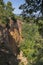 Ochre Trail in Roussillon, Hiking path in orange ocher cliffs surrounded by green forest in Provence, Southern France