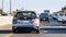 Oct 24, 2019 Mountain View / CA / USA - Back view of the new Nissan Leaf driving on the carpool lane on a busy freeway in Silicon