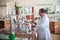 October 14, 2014.Ukraine.Kyiv. Caucasian middle-aged woman in a white coat in the chemical laboratory. A specialist at work, on