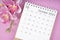 The October 2023 calendar desk and pink orchid on pink color background