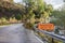 October 3, 2017: Sign showing closed road. Water in the road. Flooding from the river Tovdalselva in Kristiansand