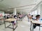 October 30, 2019, Kolkata, India. Medical students writing a medical examination in examination hall wearing white coats during
