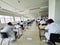 October 30, 2019, Kolkata, India. Medical students writing a medical examination in examination hall wearing white coats during