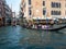 October 31, 2023 - Venice, Italy: Group of tourists on a gondola in the grand canal in Venice