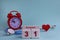 October 31. Day of the 31th month, calendar date. White wooden calendar blocks with date, clock and stethoscope on blue pastel