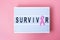 October Breast Cancer Awareness month, Pink Ribbon on lightbox with SURVIVOR text background for supporting people living and