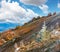 October Carpathian mountain Borghava plateau with first winter snow and autumn colorful bilberry bushes