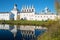 October day in the monastery pond. View of the bell tower of the Tikhvin Assumption monastery, Russia