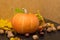 October nature concept with pumpkins, walnuts and autumn leaves