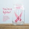 This october unite in support of breast cancer awareness month text, pink ribbon in glass jar