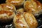 Octoberfet browned sausages frying on the pan