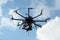 Octocopter drone with digital camera in flight,