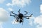 Octocopter drone with digital camera in flight,