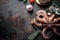 Octopus on a cutting Board with garlic and spices