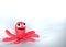 An octopus made of plasticine. Plasticine toys on white background