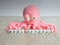 Octopus-shaped wool toy, pink color